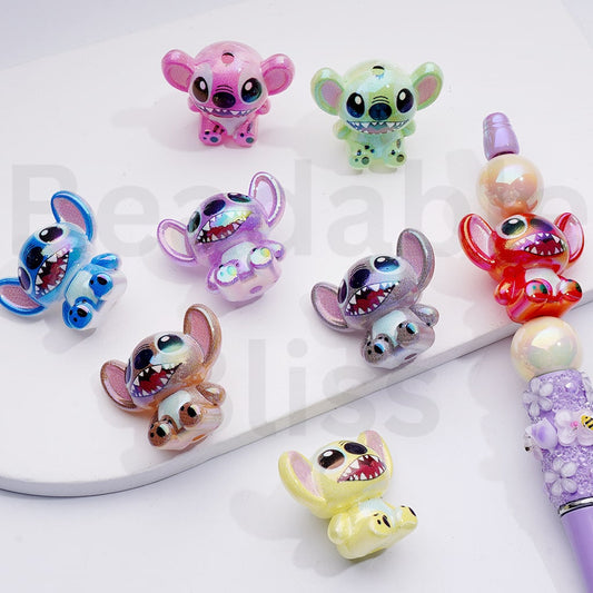 Colorful cartoon character phone charms on a white background


