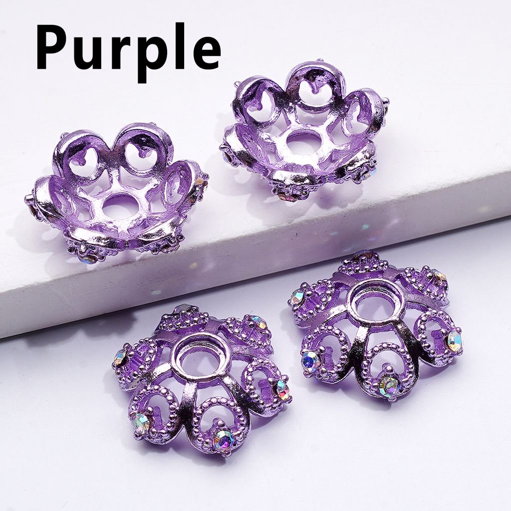 Purple decorative items with intricate designs on a white surface

