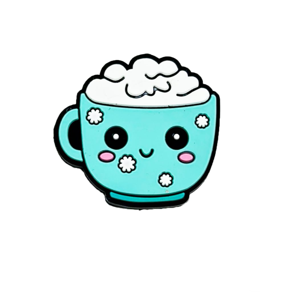 A teal-colored cup mug glass with a cute face and silicone focal beads designed to look like foam.

