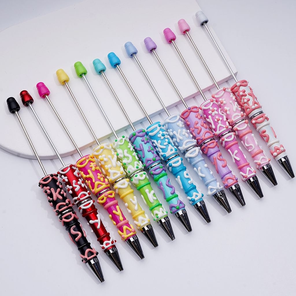 Colorful pens with decorative handles on a white background

