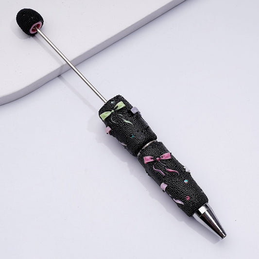 Clay Beadable Pen – Decorated with Bowknots, Mini Rhinestones & Black Snowball Accents