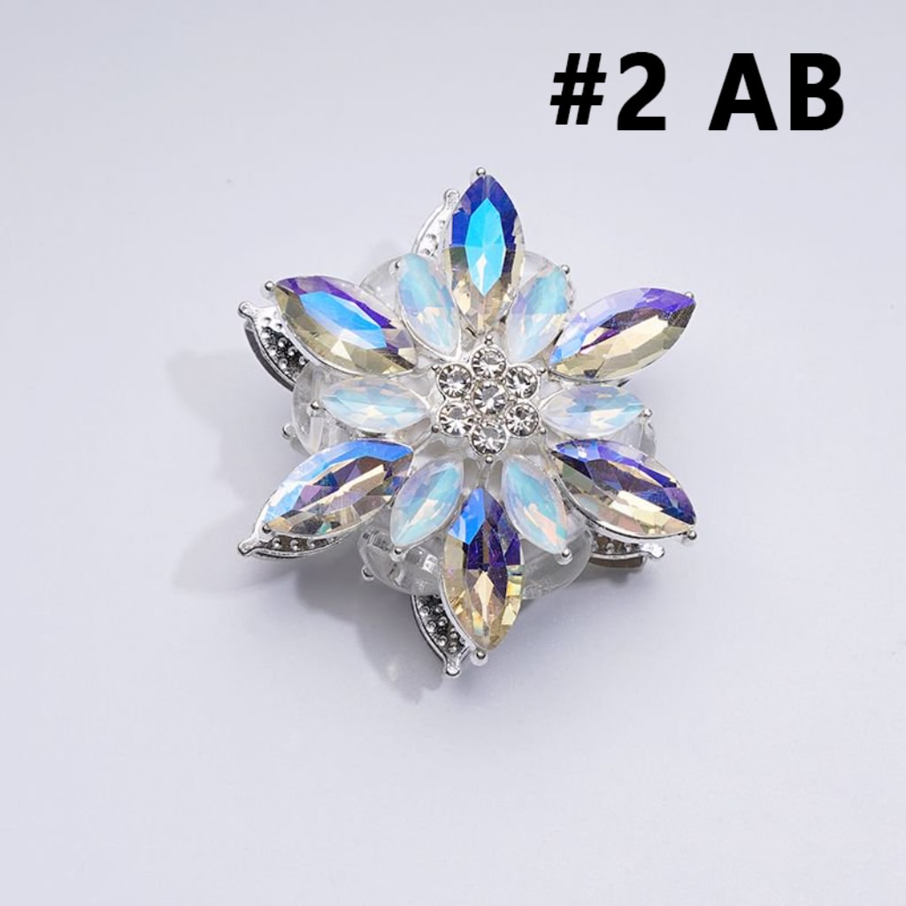 A collection of silver alloy six-petaled flowers with clear and colorful rhinestones and clay beads.

