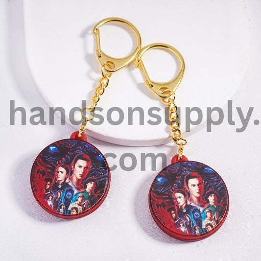 Metal Keychain with Lobster Clasp with Charm Pendant Vibrant Fantasy Character Collage on Red Background Classic Horror Style, Flat Round Shape