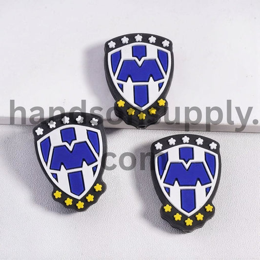 Shield Shape with Blue "M" Text and White & Yellow Colors Blossom Silicone Focal Beads