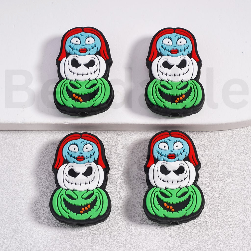 Four identical decorative items resembling Russian nesting dolls with a skeleton face design on a white background.

