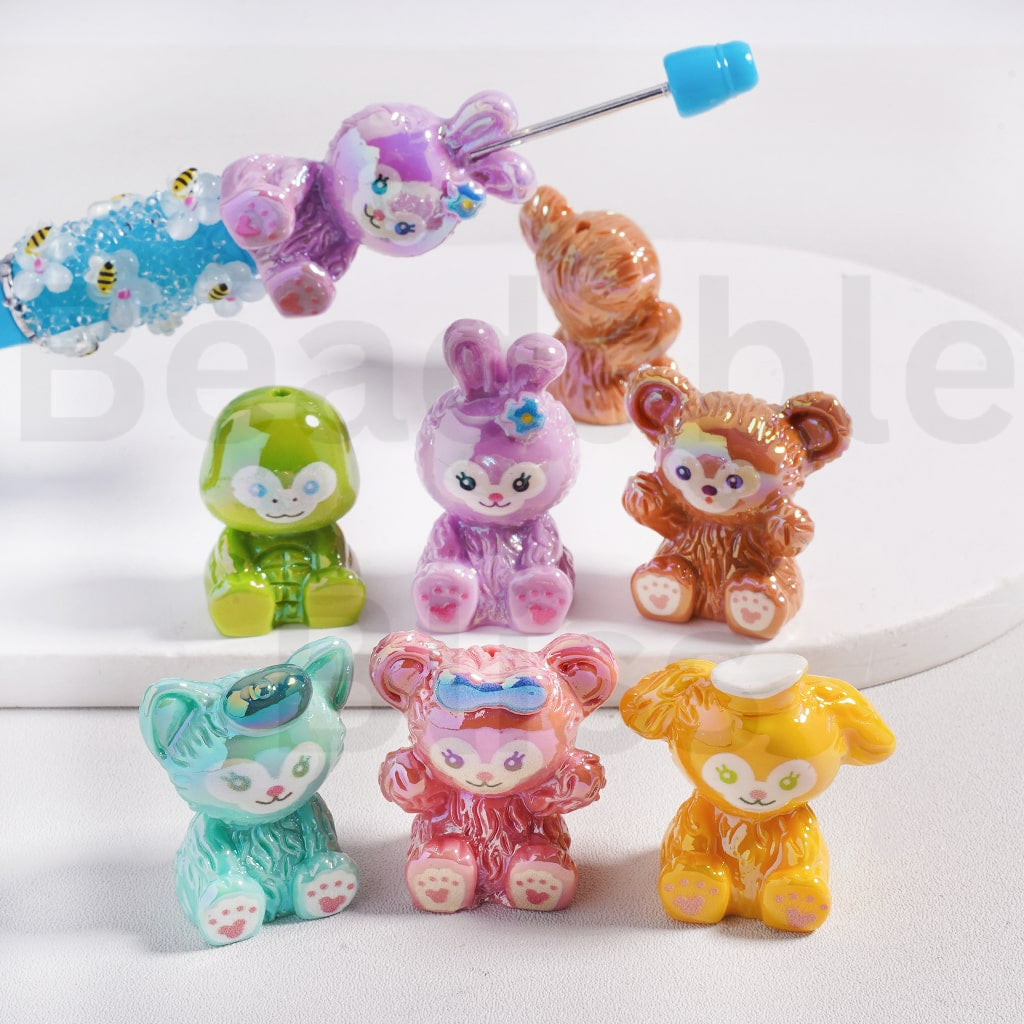 Colorful animal figurines on a white surface with 'bedablebliss branding.

