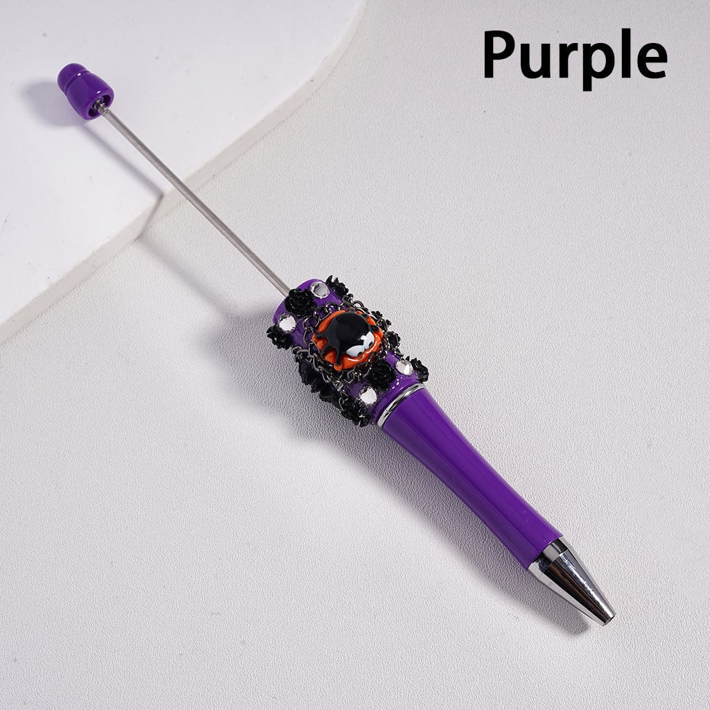 Purple pen with decorative elements on a light gray background

