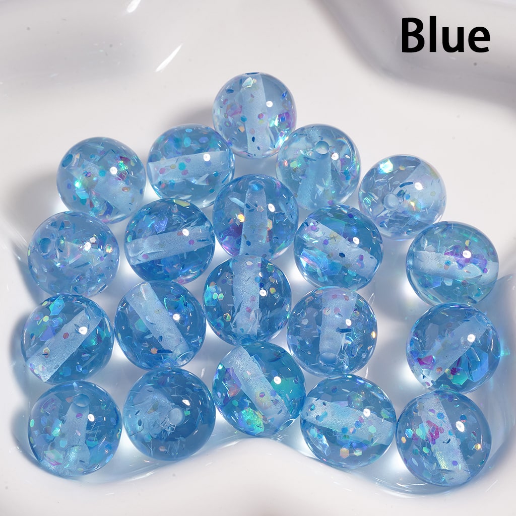 Blue marbles with glitter on a white background

