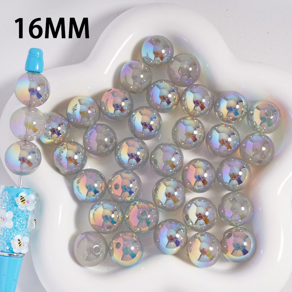 Iridescent beads on a white plate with '16MM' text

