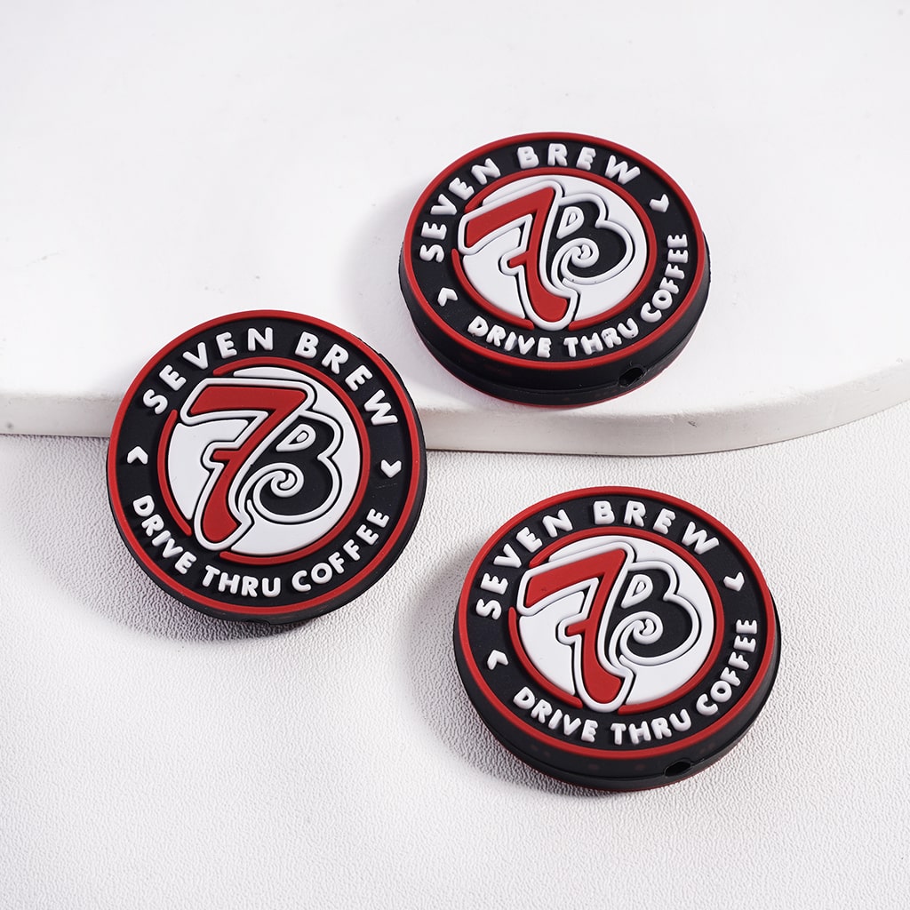 Three Seven Brew coffee cup lids on a white background

