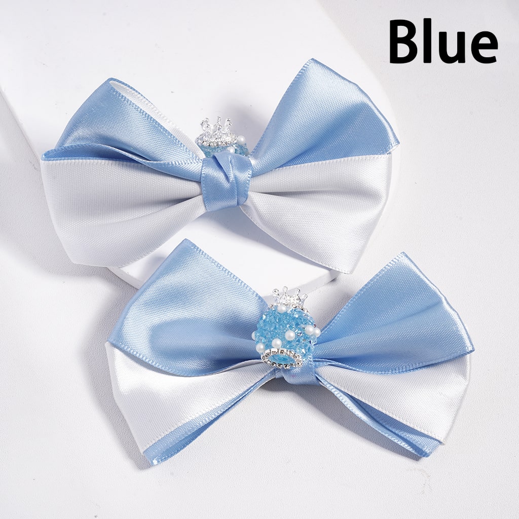 Two blue and white bows with decorative elements on a white background.