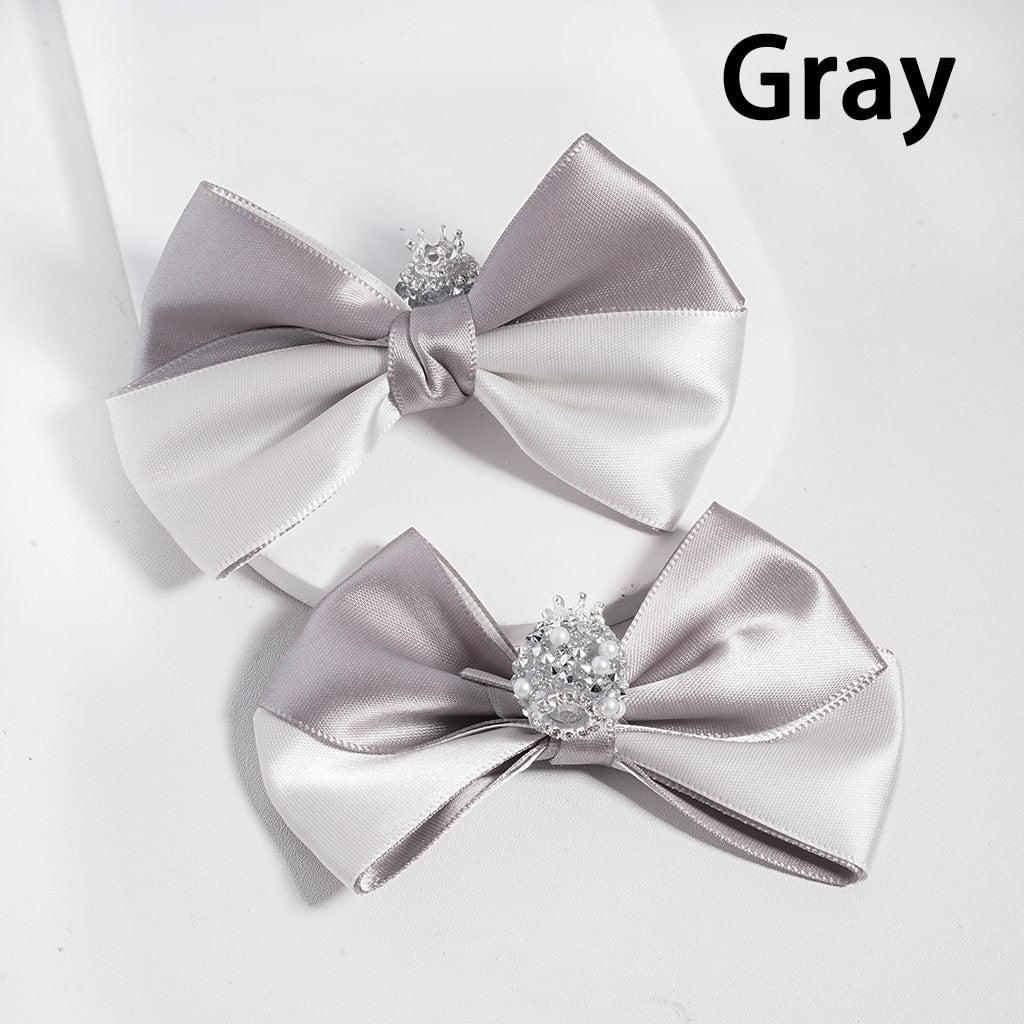 Two gray satin bows with decorative elements on a white background, labeled 'Gray'.

