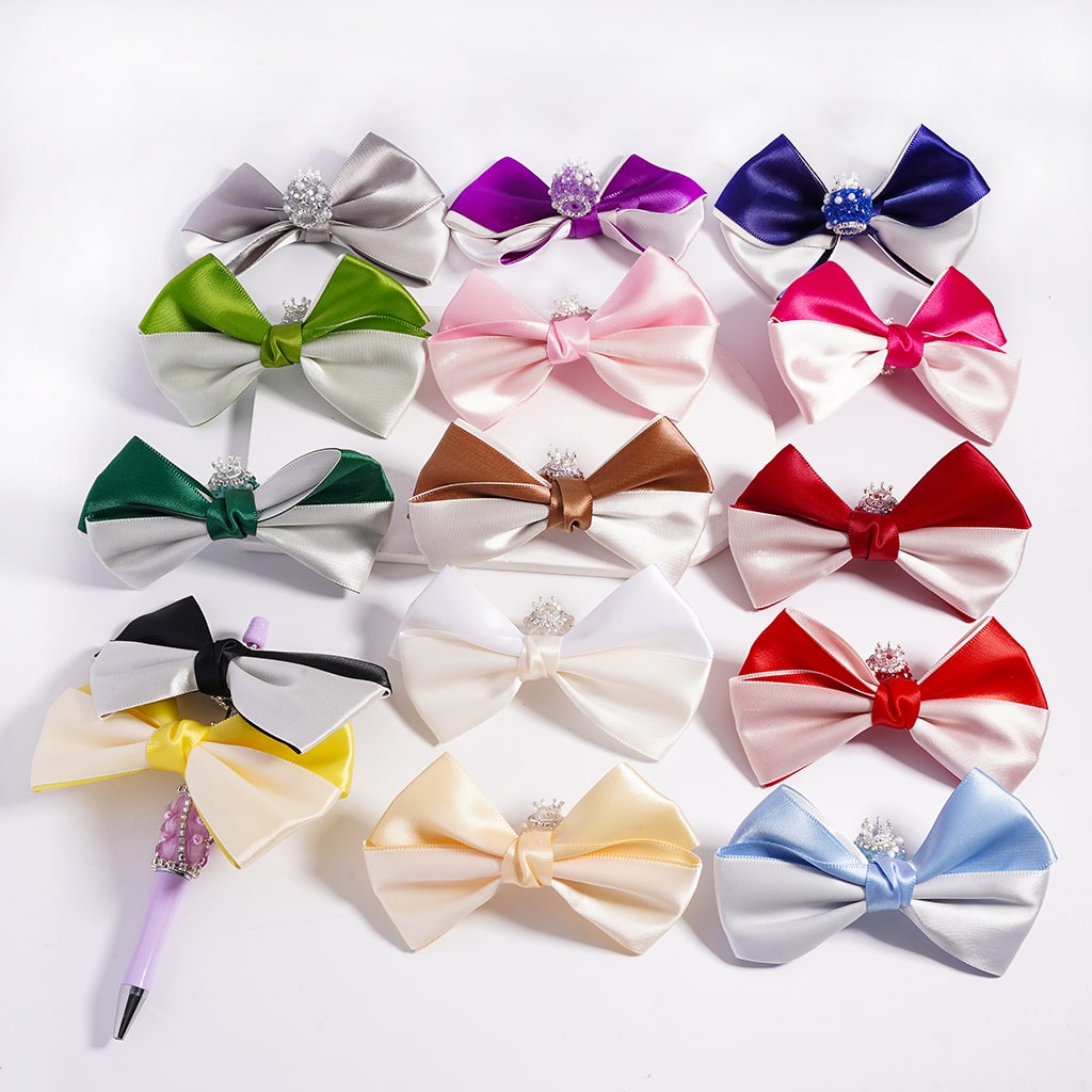 Collection of colorful bow-shaped hair accessories on a white background


