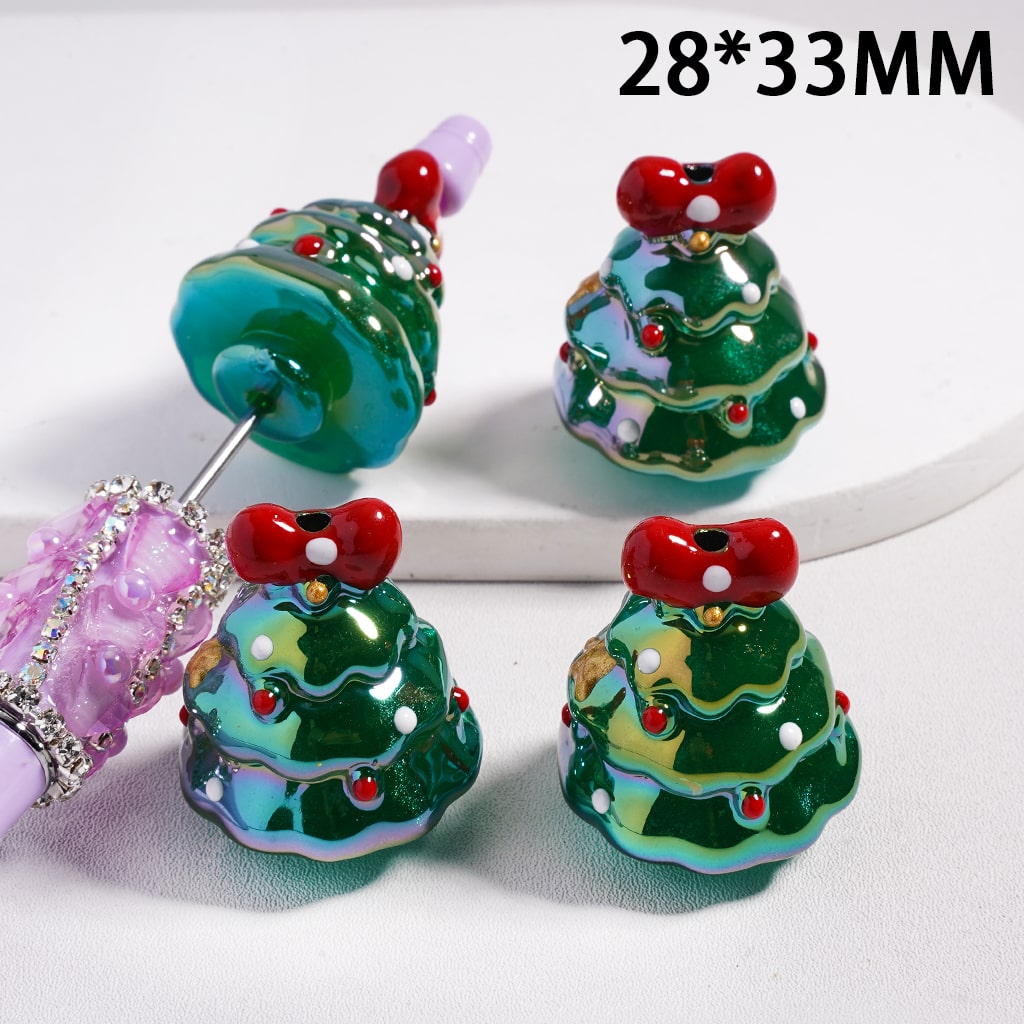Decorative Christmas tree beads with red cherries on a white background

