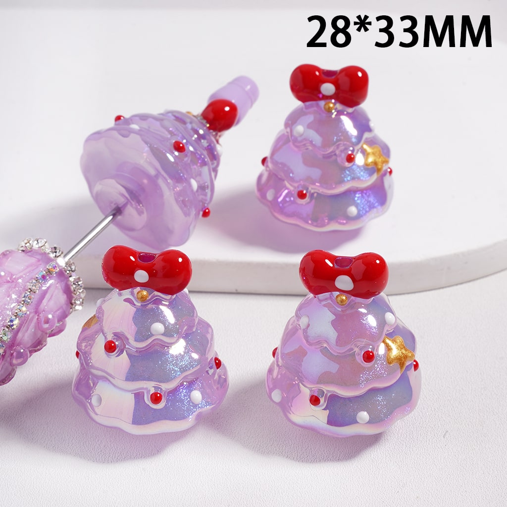 Decorative purple beads with red bows and small gold accents on a white background

