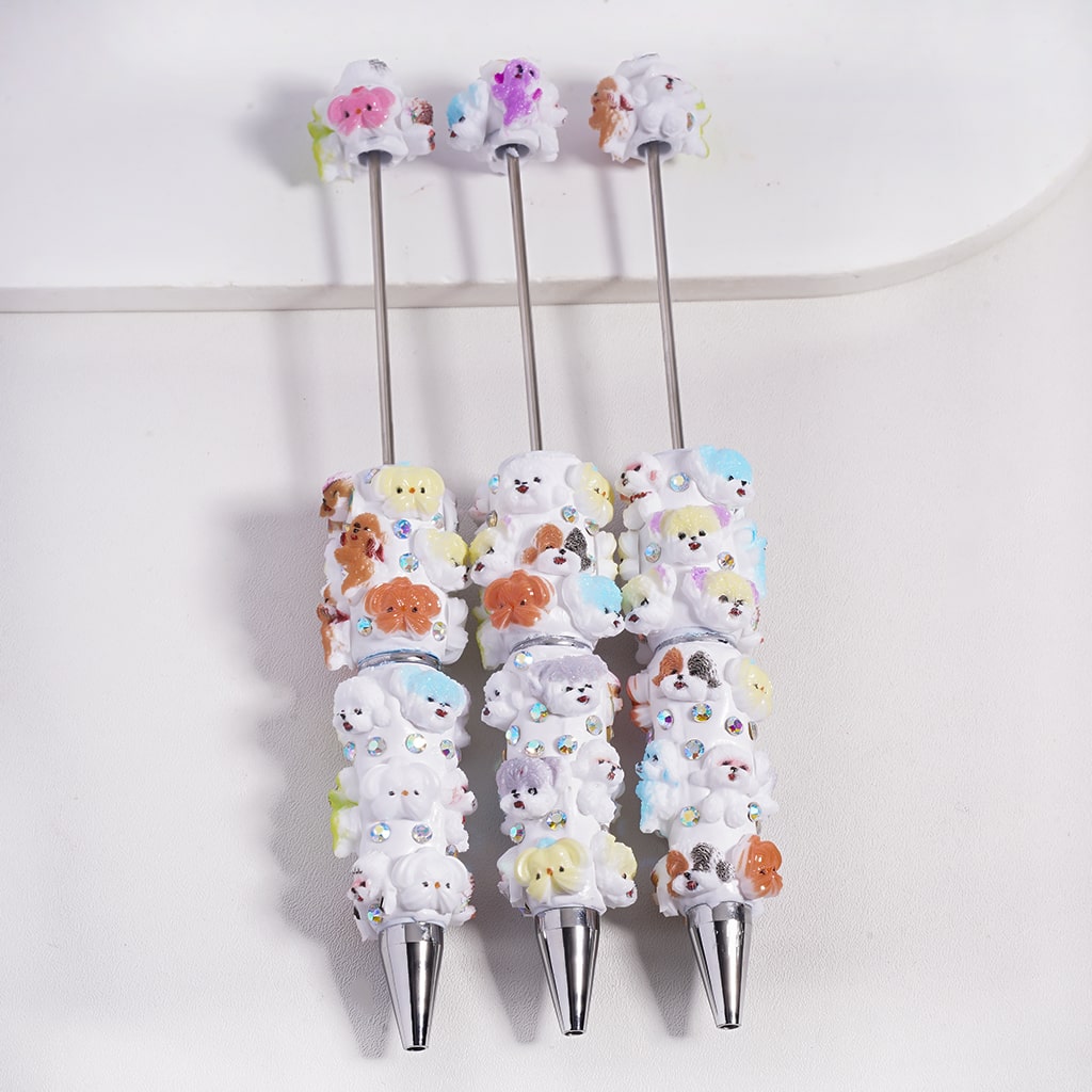 Set of pens with cute animal designs on a white background

