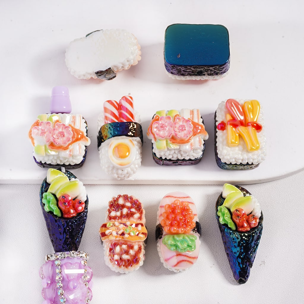 Colorful sushi-shaped candies on a white plate