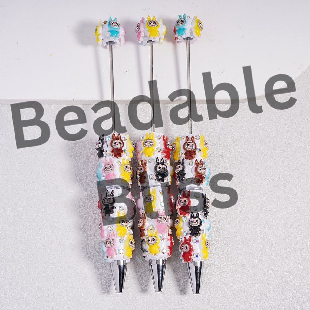 Set of cartoon character pens with colorful designs on a white background, branded 'beadablebliss.'