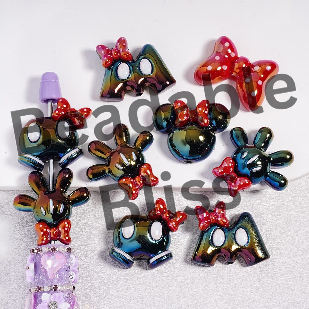 Colorful letter-shaped hair accessories with bow details on a white background
