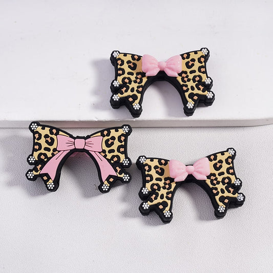 Glittery Pink Bowtie over a Bigger Bowtie and White Flowers Silicone Focal Beads