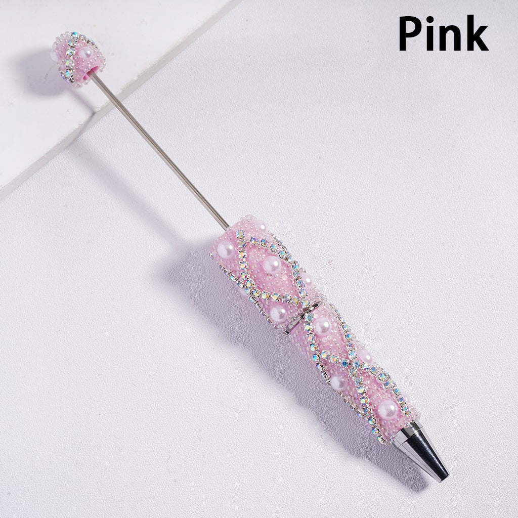 Pink pen with decorative elements on a light gray background