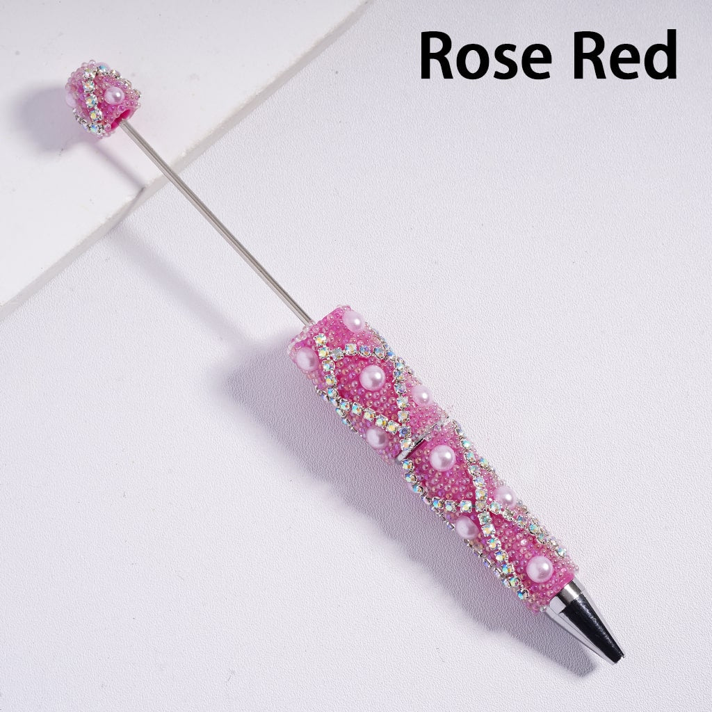 Decorative pen with rose red accents on a white background