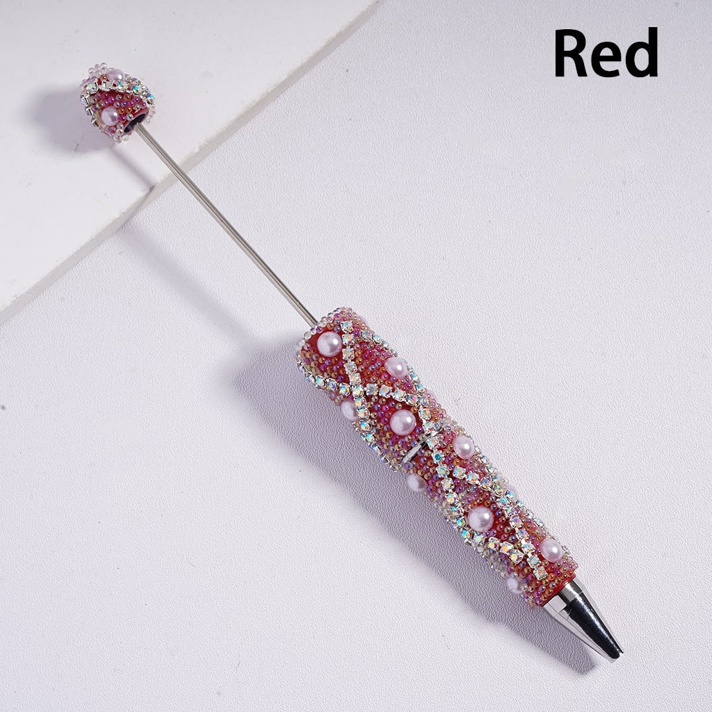 Decorative pen with red and silver design on a white background