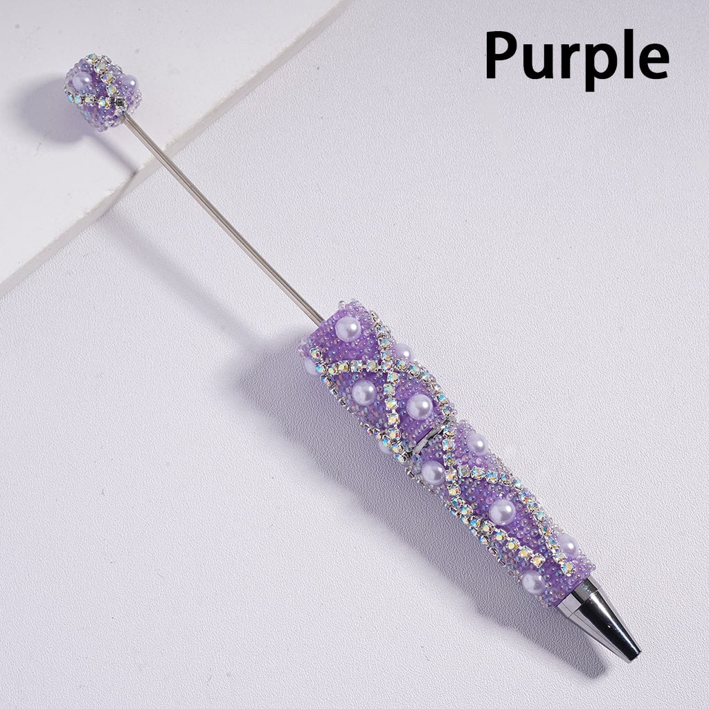 Decorative purple pen with gemstones on a light gray background