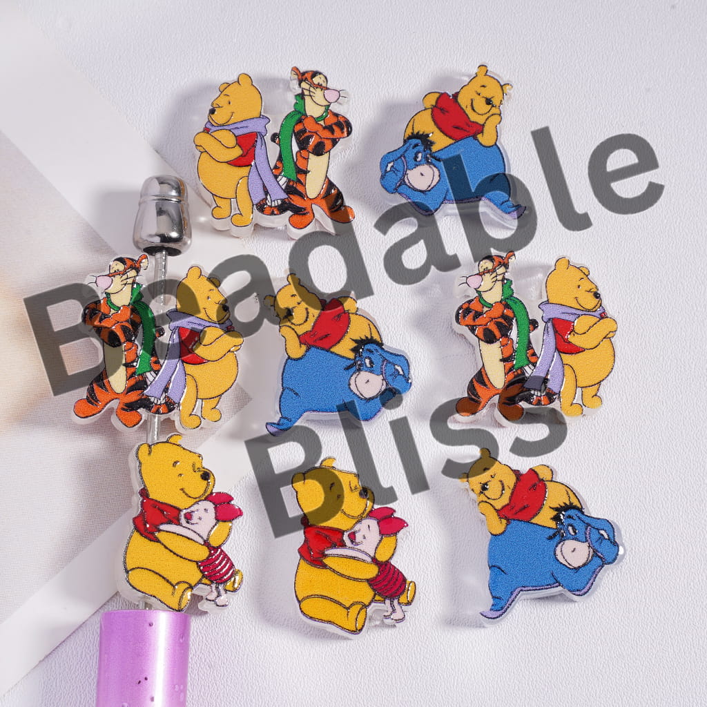 Set of colorful cartoon character pins on a white background