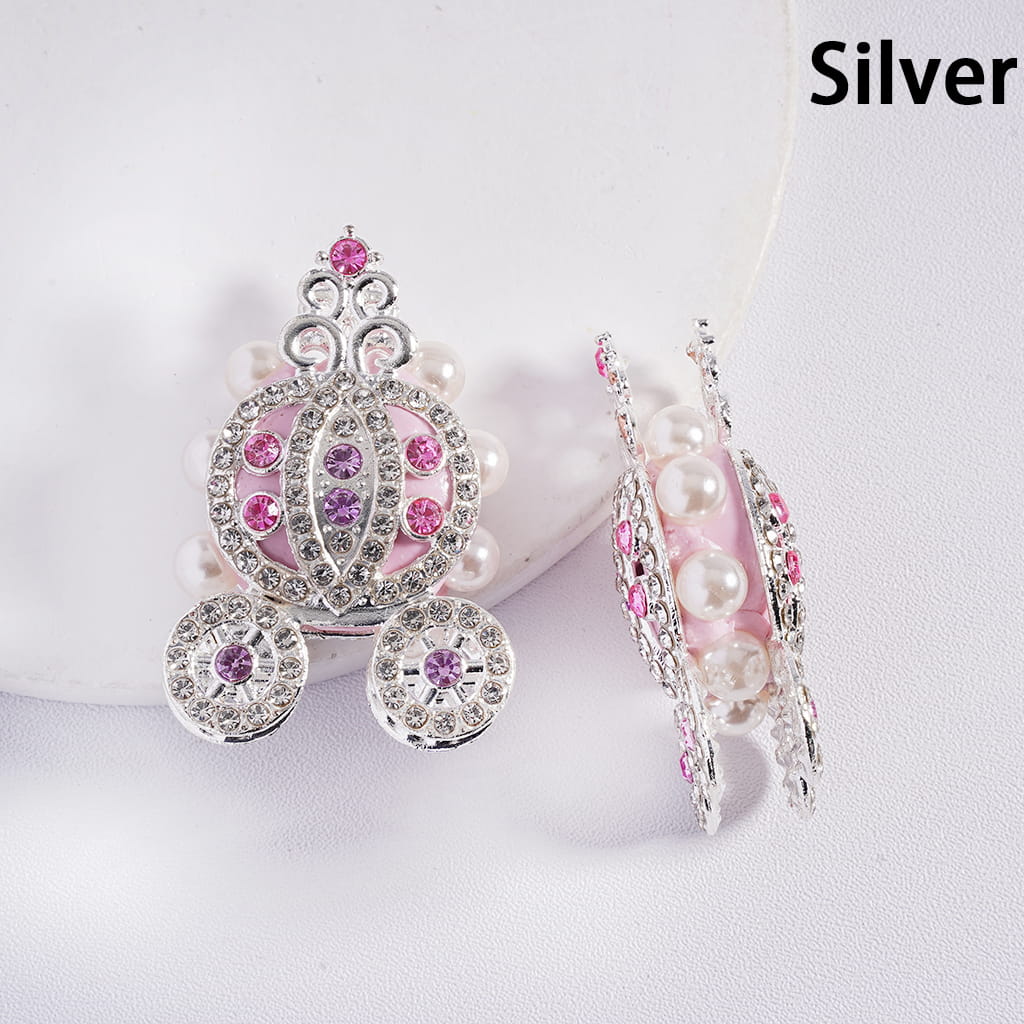 Silver earrings with pink and purple gemstones on a white background