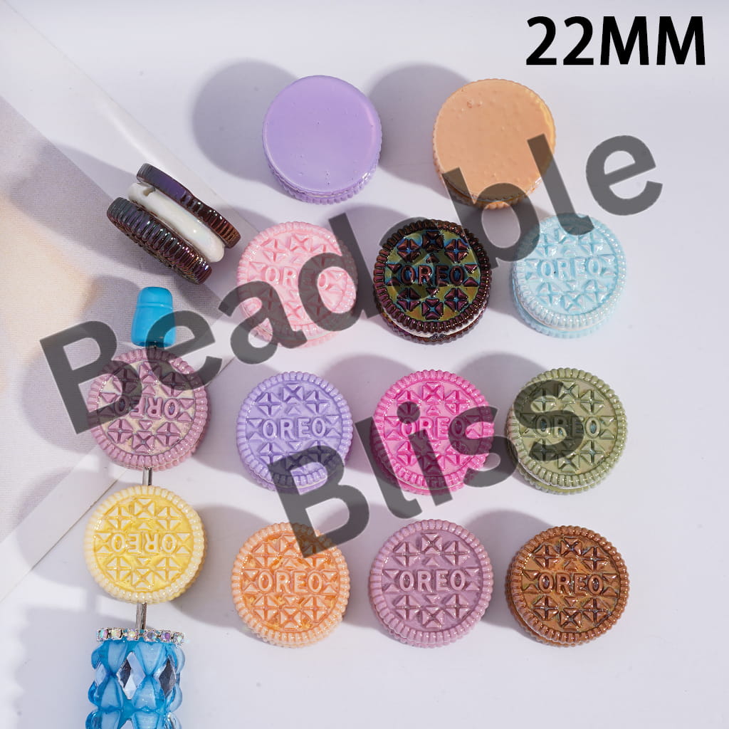 Colorful Oreo cookie-shaped earrings on a white background with 'handsome supply' branding.