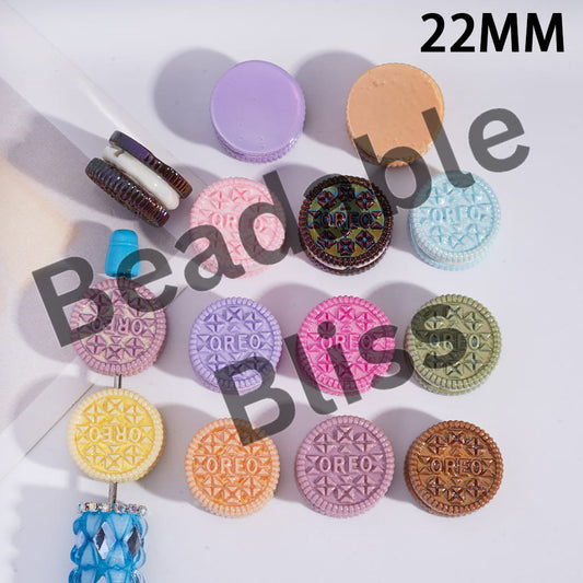 Colorful Oreo cookie-shaped earrings on a white background with 'handsome supply' branding.