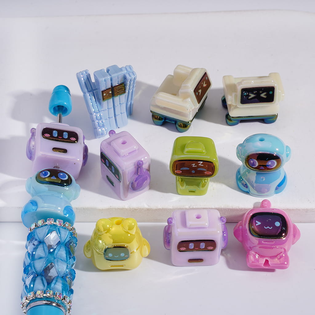 Collection of colorful robot-shaped toys on a white background