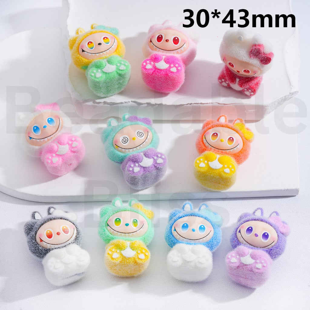 Set of colorful plush toys with cartoon faces on a white background

