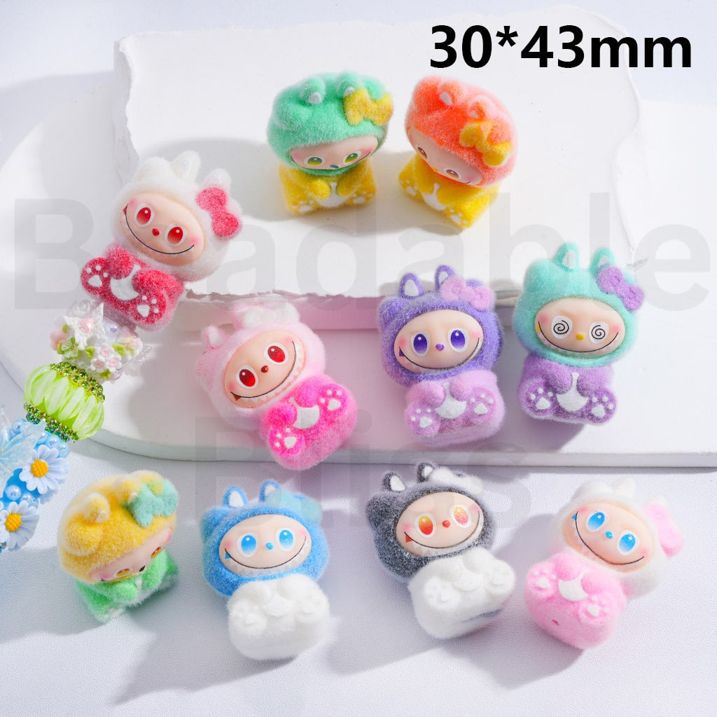 Colorful cartoon character buttons on a white background with 'beadablebliss' branding.

