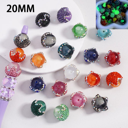 Colorful beads with glittery textures on a white surface, labeled '20MM'.