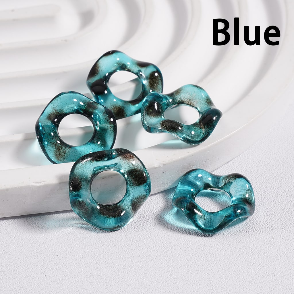 Blue rubber bands on a white background with 'Blue' text.

