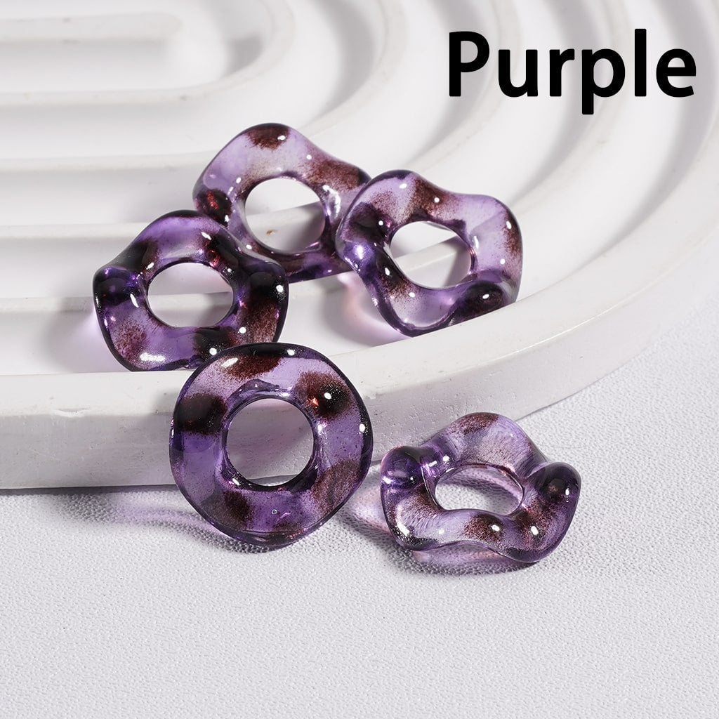 Purple decorative items on a white surface with 'Purple' text above.

