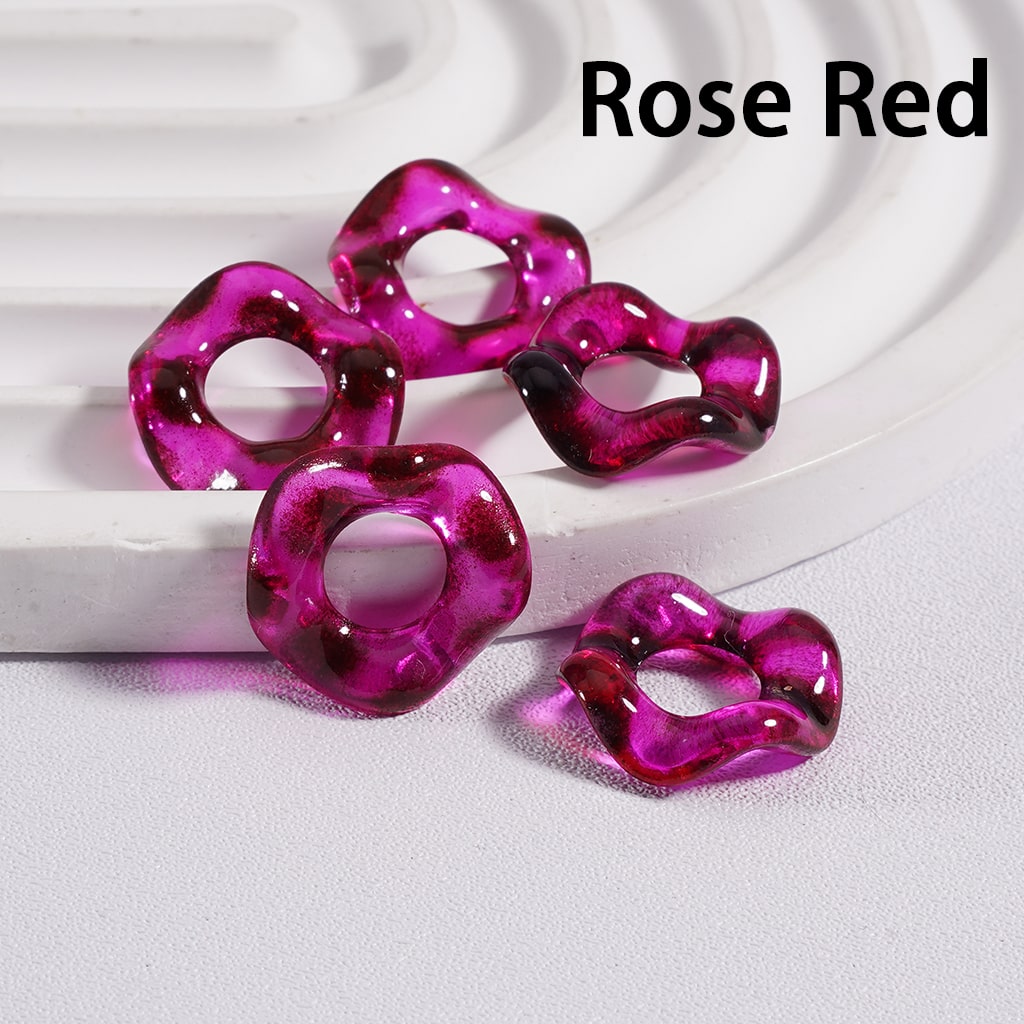 Rose red plastic rings on a white surface with 'Rose Red' text above.


