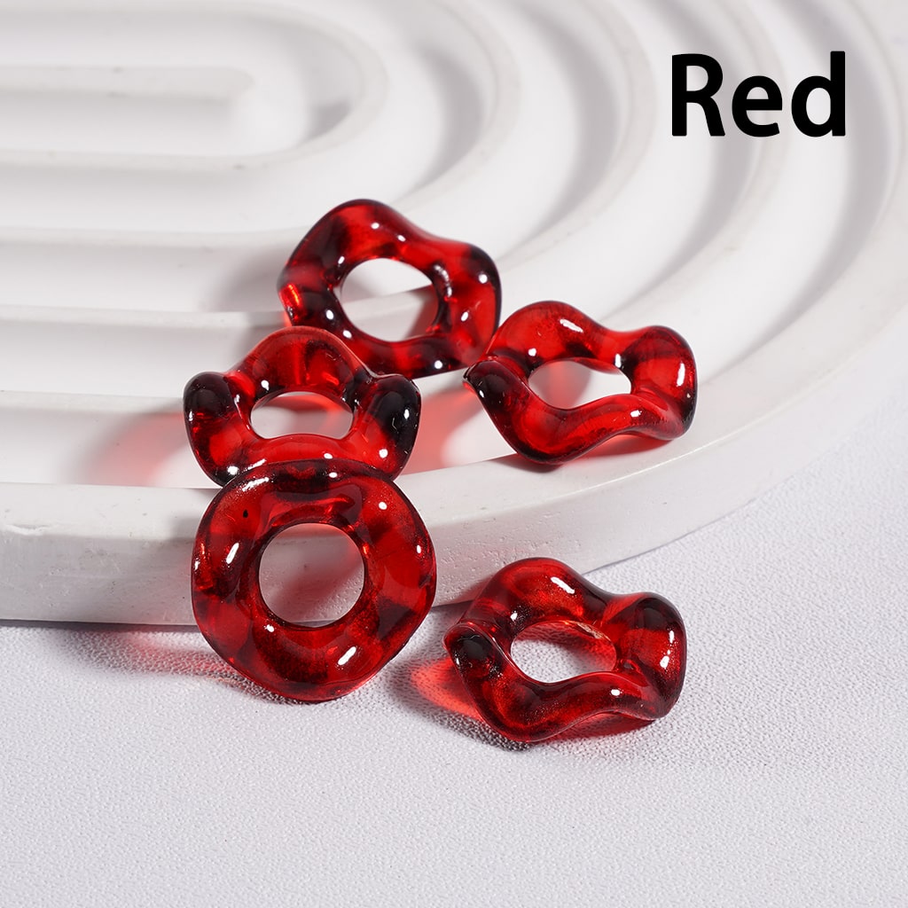 Red heart-shaped earrings on a white background with 'Red' text.

