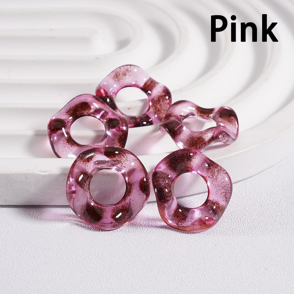 Pink rubber band with a white background

