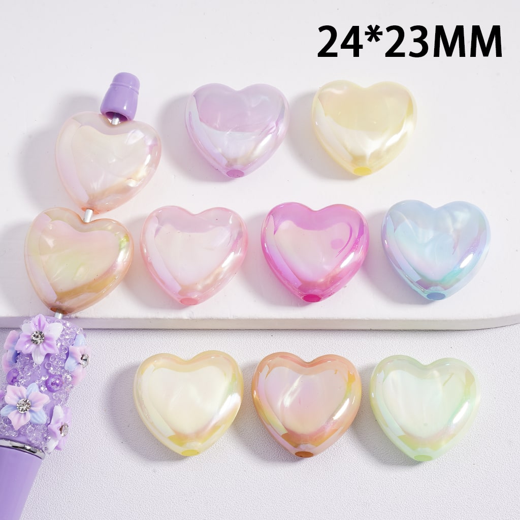Heart-shaped pastel-colored stones on a white background with dimensions 24*23MM.

