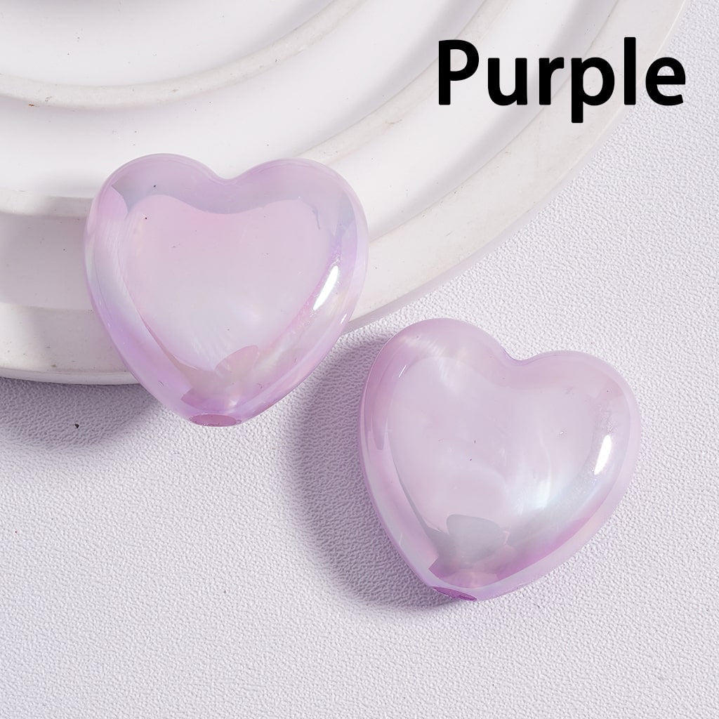 Two purple heart-shaped objects on a light gray background with 'Purple' text above.

