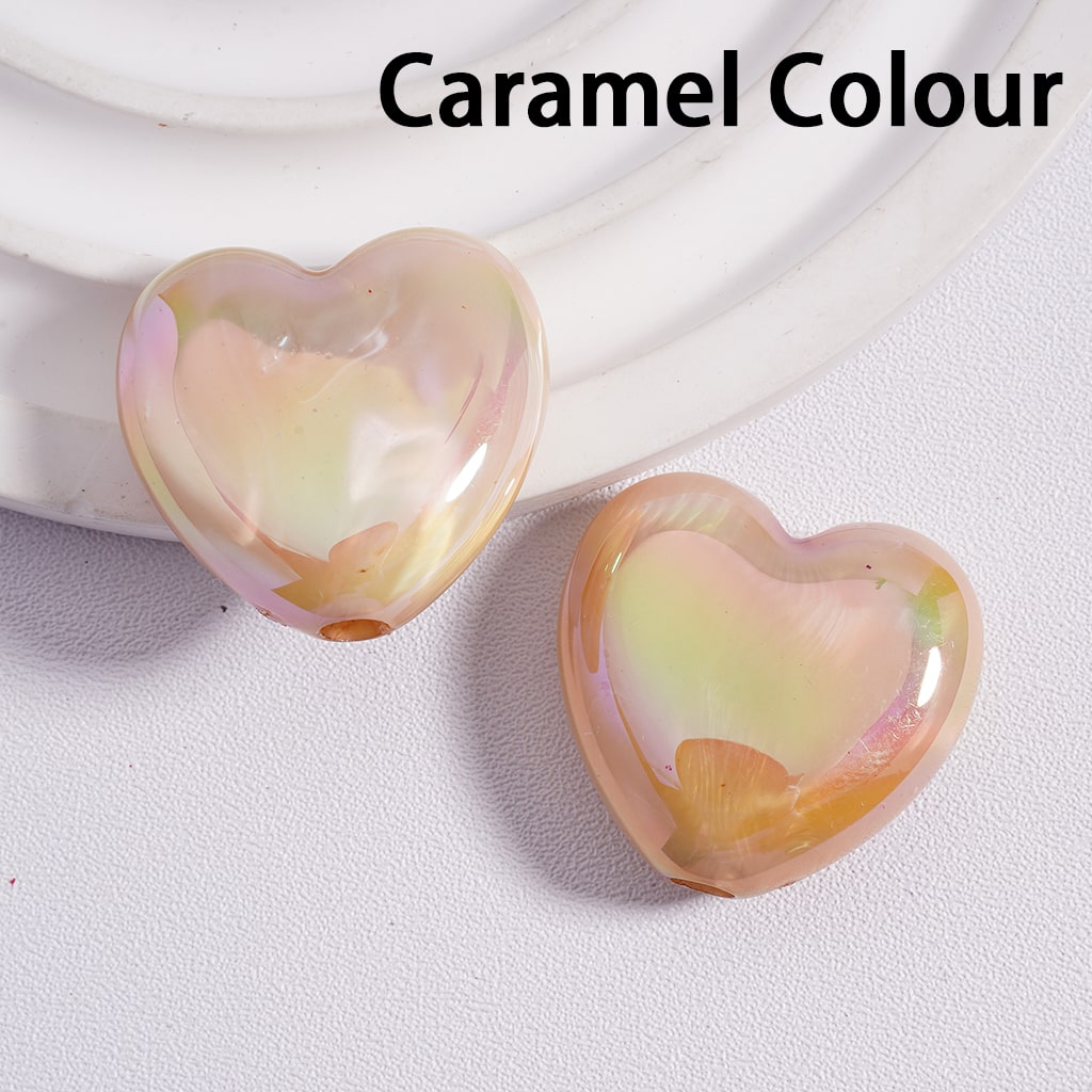 Heart-shaped objects with a caramel color on a light background

