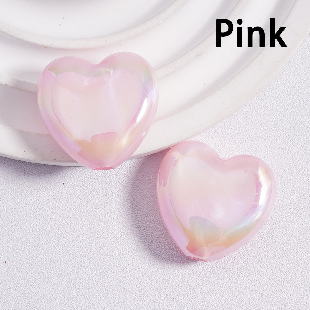 Heart-shaped pink objects on a white surface with 'Pink' text.

