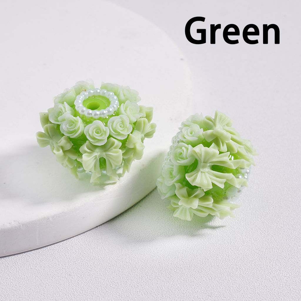 Green floral earrings on a white background with 'Green' text above.

