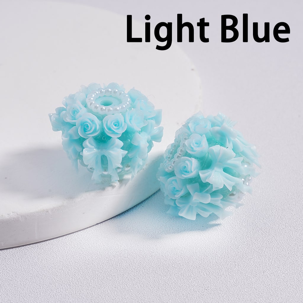 Light blue floral earrings on a white background with 'Light Blue' text.

