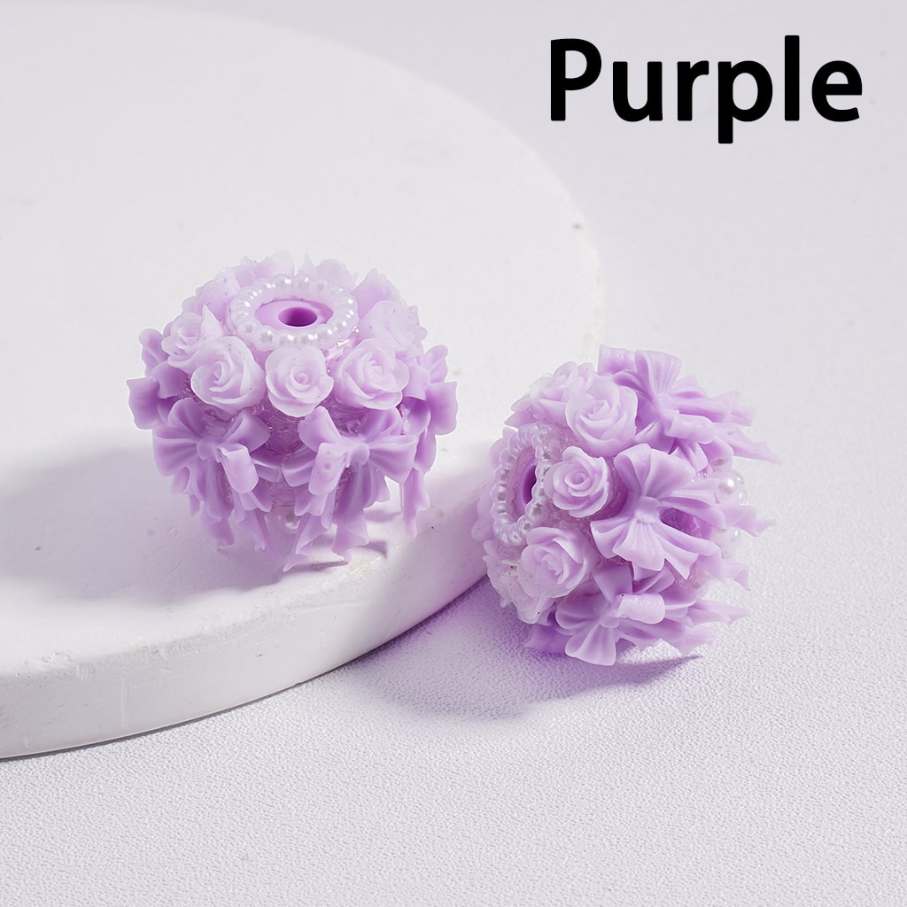 Purple floral earrings on a white background with 'Purple' text above.

