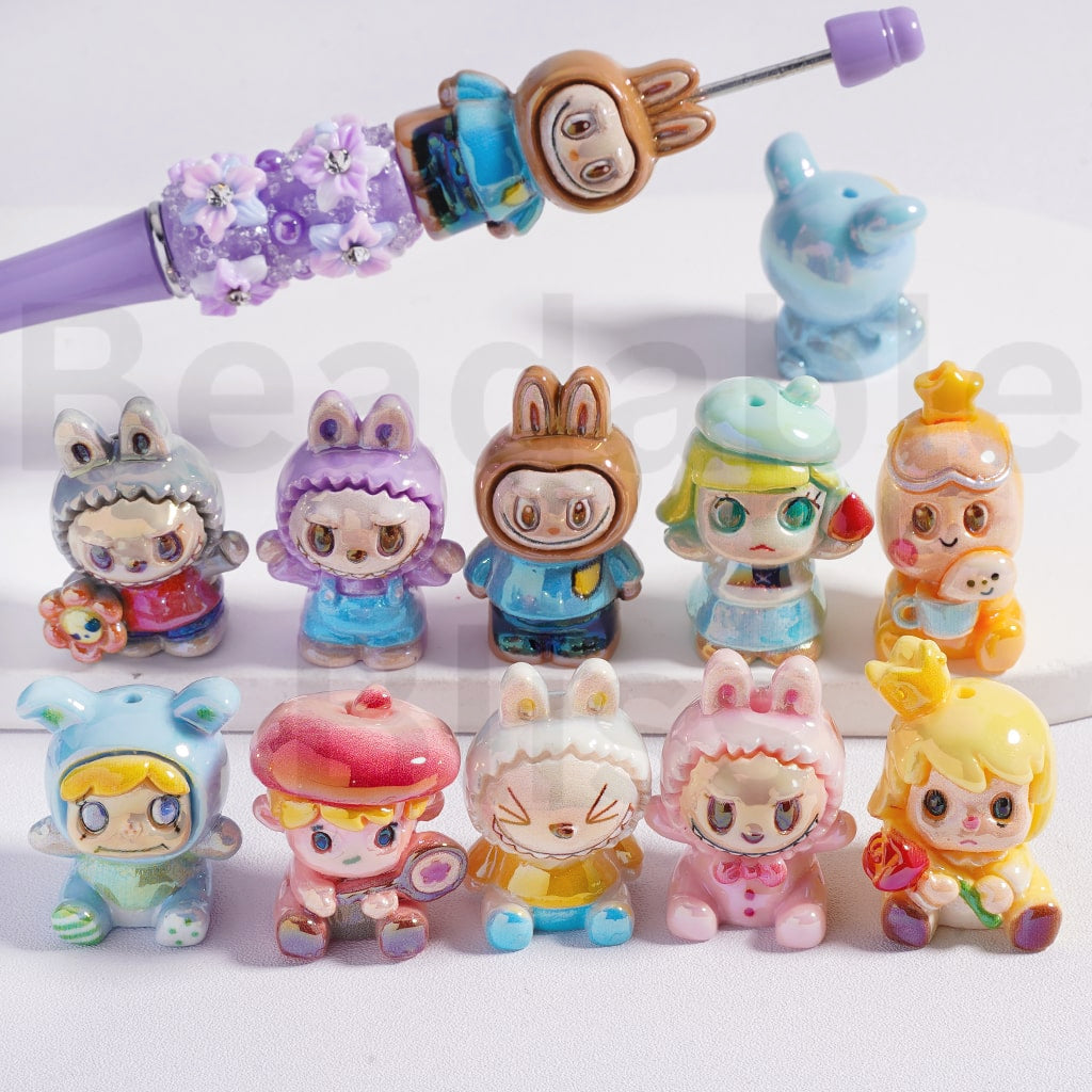 Set of small figurines with a hairbrush on a white background


