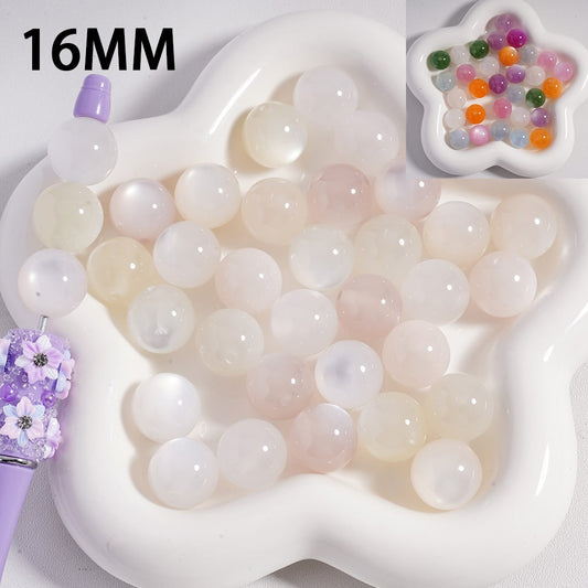 16MM round beads in a white tray with colorful beads in a star-shaped container.

